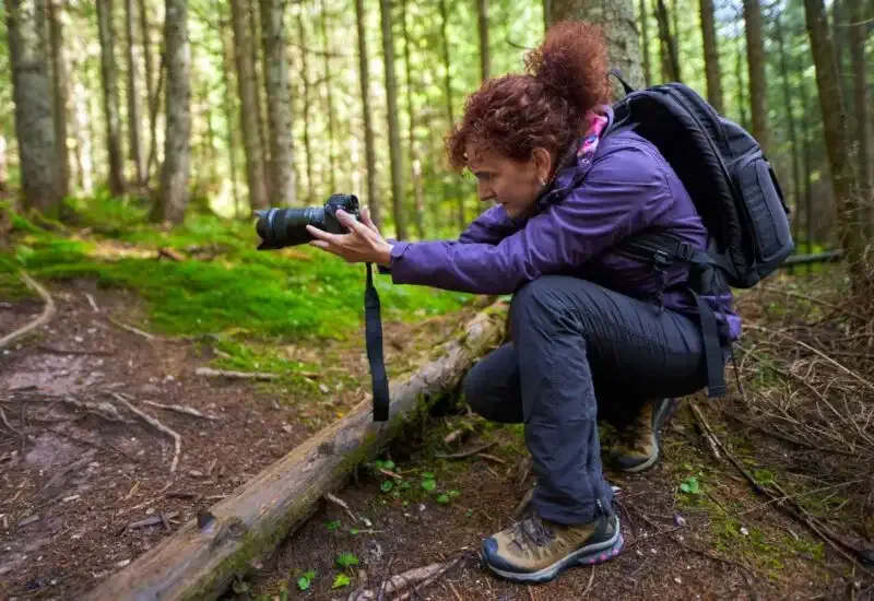 A woman checking her camera