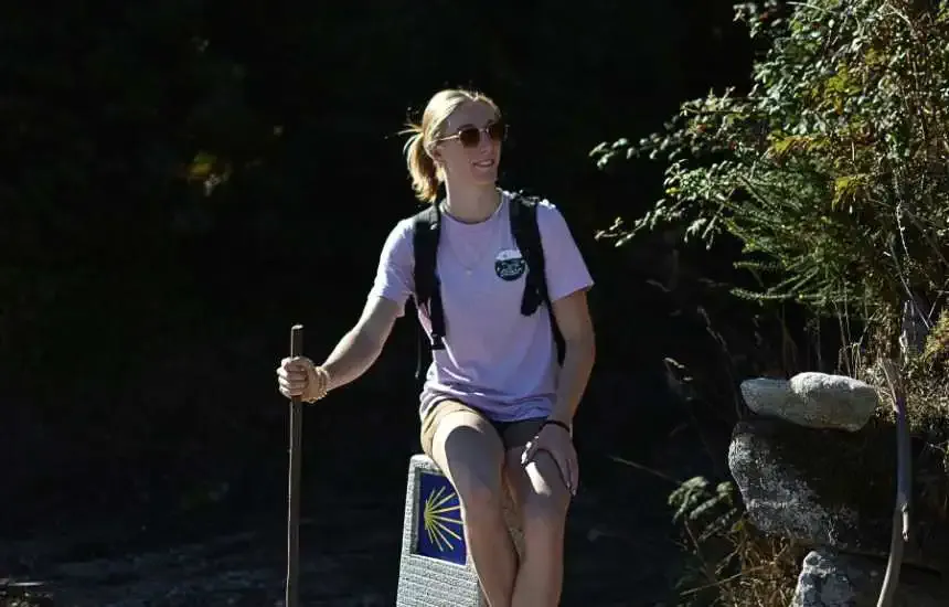 A happy pilgrim walking the Camino alone