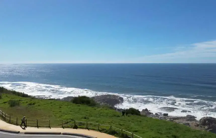 A Pilgrim Walking Alone by the Atlantic Ocean